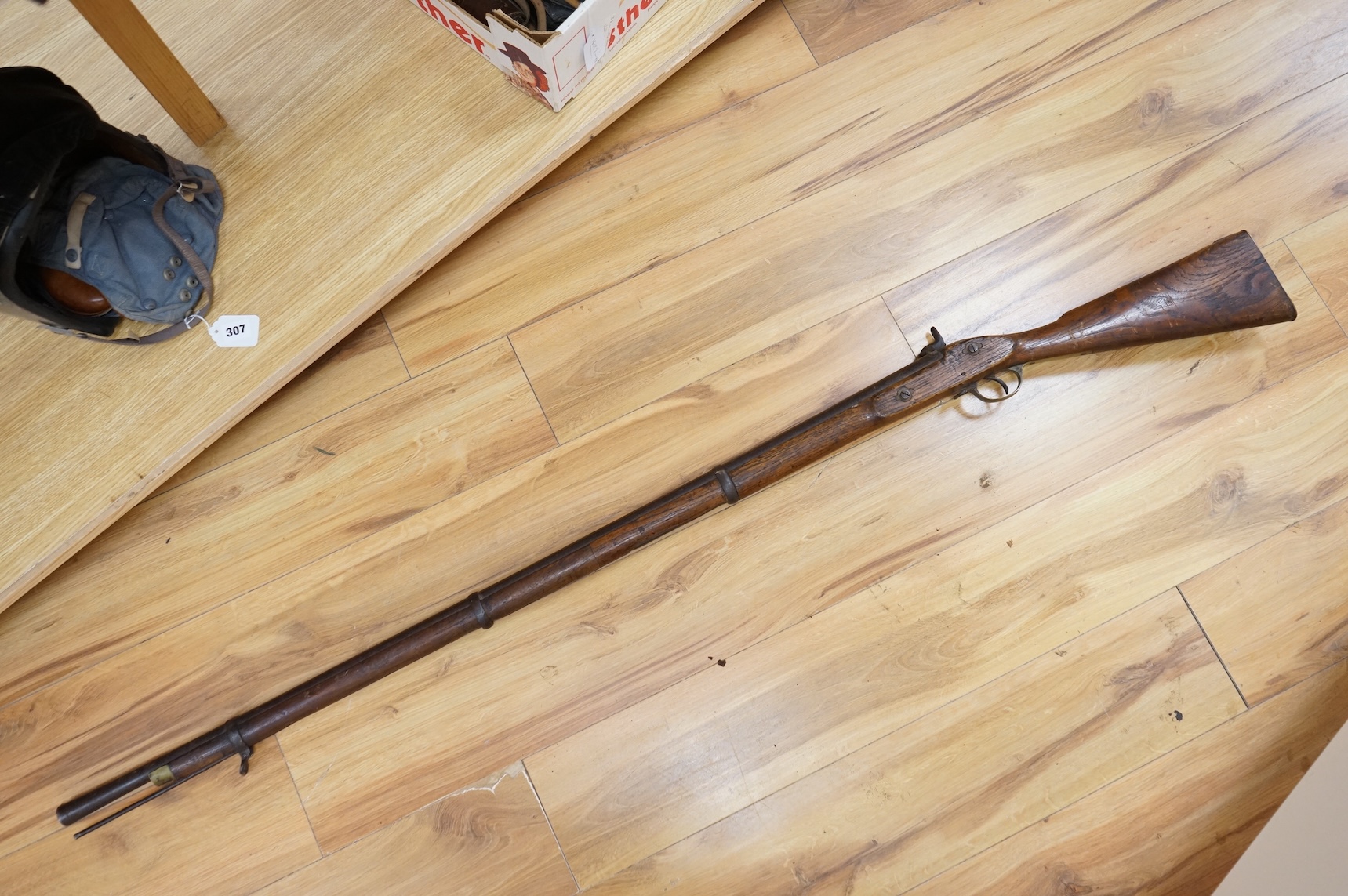 An Indian military style percussion musket, fully stocked, barrel 115cm, with military style brass mounts, iron barrel bands and Enfield style lock, partly 19th century